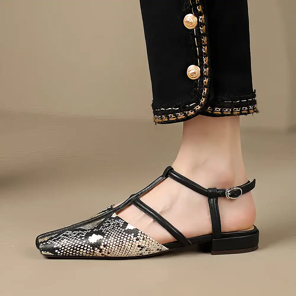 High-quality women's snake print flat shoe with pointed toe and ankle strap, perfect for stylish comfort and versatile fashion looks.