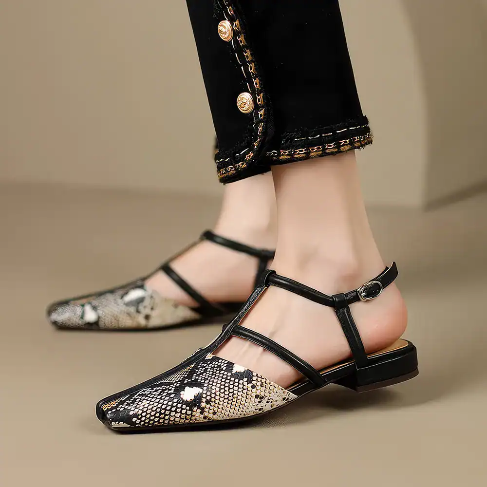 Stylish snake print pointed toe T-strap flats with adjustable ankle strap for comfortable fit, perfect for fashion-forward women seeking sophisticated footwear.
