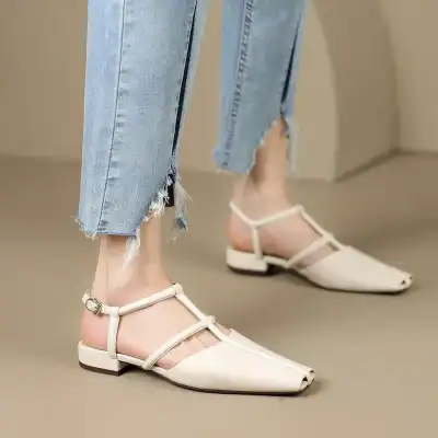 Stylish women's pointed toe sandals showcased in neutral beige, featuring slim ankle straps with buckle closures, perfect for fashionable summer wear.