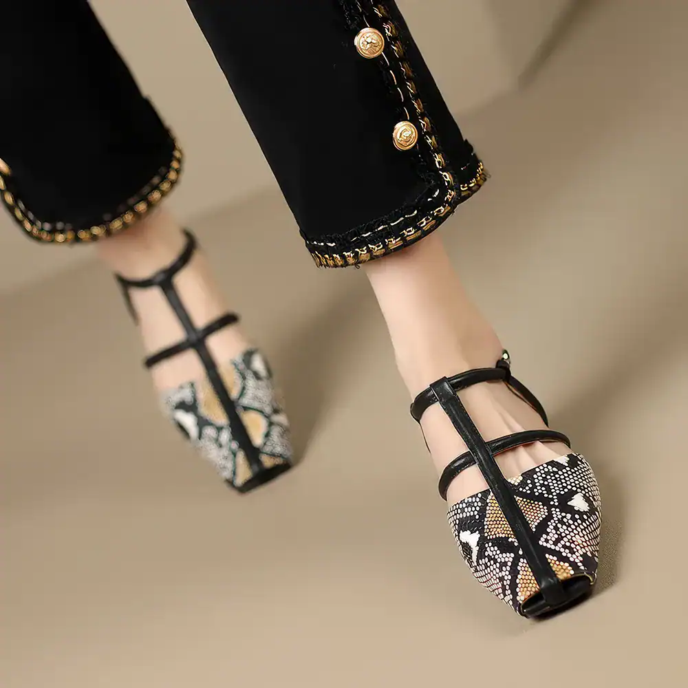Stylish snake print high-heel shoes featuring black straps, perfect for fashionable women seeking sophisticated footwear for special occasions.