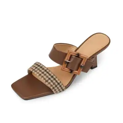 Elegant women's brown heeled sandal featuring a buckle strap and houndstooth fabric detail, perfect for stylish outings and comfortable wear.