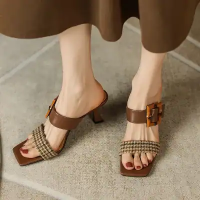 Stylish brown high-heeled sandals with houndstooth fabric accents and decorative buckles, perfect for fashion-forward women seeking comfort and style.