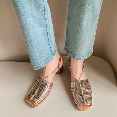 Elegant metallic open-toe sandals with ankle straps, perfect for stylish outings.