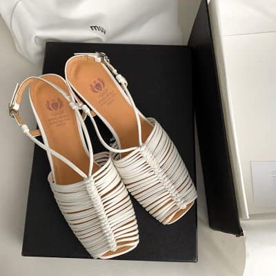 Elegant white strappy high heels for women, perfect for formal or casual occasions, blending style and comfort.