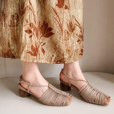 Stylish women's beige woven shoes with ankle straps, chunky heels, and open toes, perfect for fashion-forward women seeking comfort and sophistication.