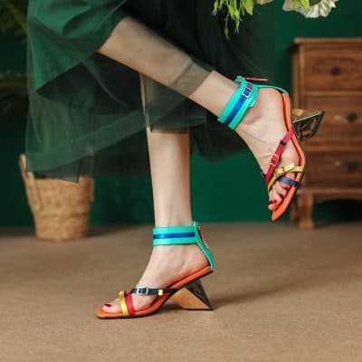 Vibrant women's heels with colorful straps, trendy open-toe design, perfect for fashion-forward outfits and special occasions.