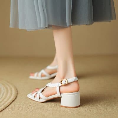 Elegant women's footwear, white block heel sandals with ankle strap for comfortable wear, perfect for fashion and everyday use.