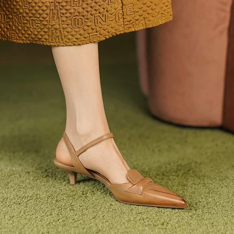 High-quality women's leather dress shoes with pointed toes and ankle straps, ideal for stylish occasions and professional wear.