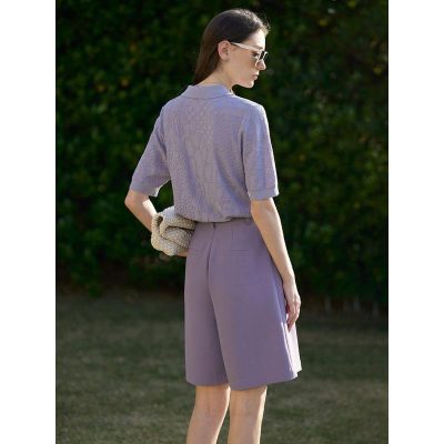 Stylish women's purple shorts and sweater, chic sunglasses, and a cozy handbag perfect for summer fashion and outdoor outings.