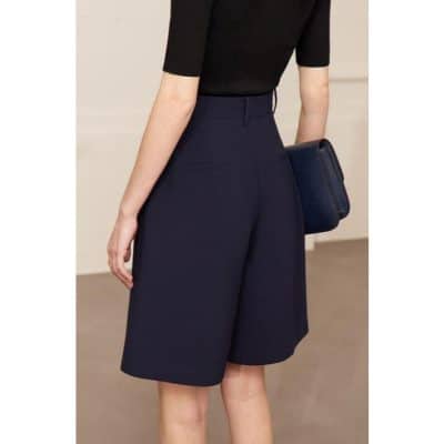 Stylish navy tailored shorts perfect for professional or casual wear, featuring a high waist and clean design. Ideal for fashionable, comfortable summer outfits or office attire.