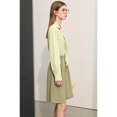 Image features a woman with light brown hair and glasses, showcasing trendy eyewear at Monalisa Store, highlighting modern styles for optical needs.