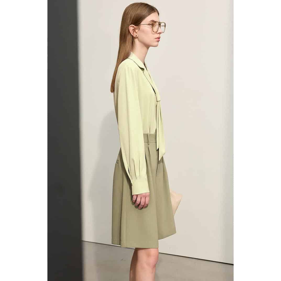 Image features a woman with light brown hair and glasses, showcasing trendy eyewear at Monalisa Store, highlighting modern styles for optical needs.