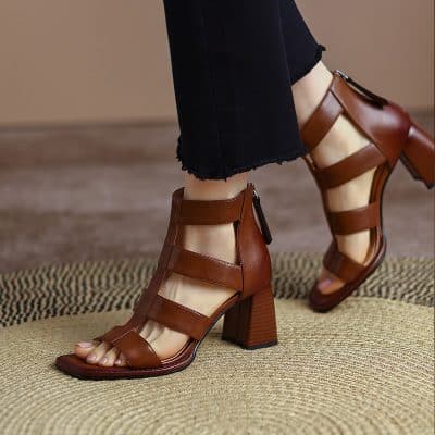 Elegant brown open-toe high-heel sandals with multiple straps, perfect for fashionable women seeking comfort and style in their footwear.