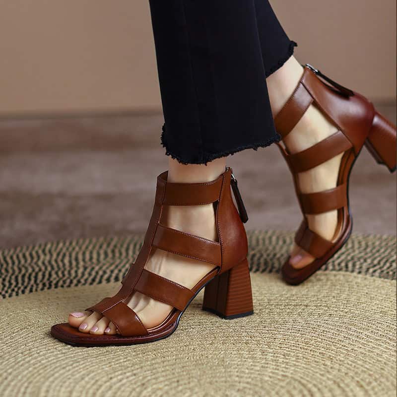 Elegant brown open-toe high-heel sandals with multiple straps, perfect for fashionable women seeking comfort and style in their footwear.
