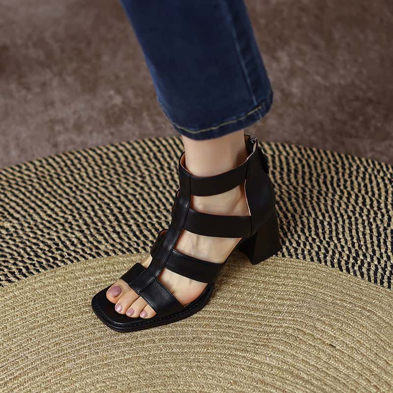 Elegant black high-heeled sandal with multiple straps, perfect for trendy fashion or formal occasions, showcasing modern footwear for women.