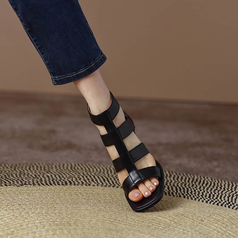 Elegant black strappy sandal for women, perfect for casual and stylish occasions. Comfortable open-toe design with sturdy straps, ideal for summer wear.