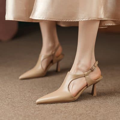 Close-up of women's nude pointed-toe high heels with ankle straps, showcasing trendy footwear options available at Monalisa Store for fashion-forward individuals.