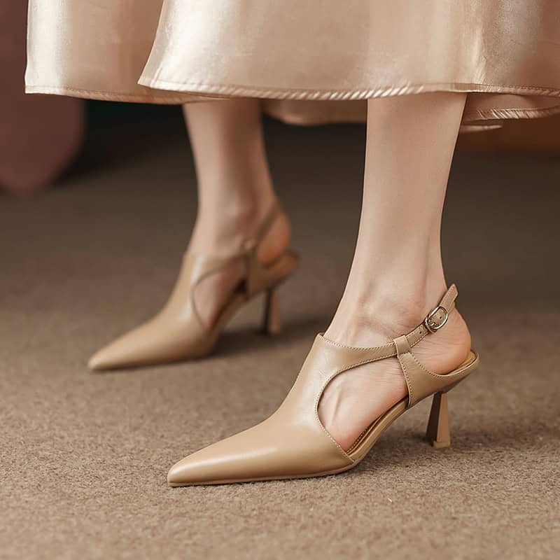 Close-up of women's nude pointed-toe high heels with ankle straps, showcasing trendy footwear options available at Monalisa Store for fashion-forward individuals.
