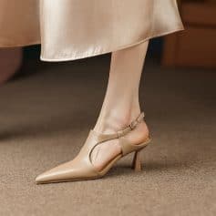 Beautiful beige high heel shoe with ankle strap, pointed toe, and comfortable fit perfect for women seeking fashionable and elegant footwear.