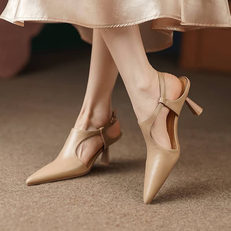 Stylish nude women's high heels with pointed toe, ankle strap, and high heel, perfect for fashion-forward footwear and comfortable yet chic shoe options.