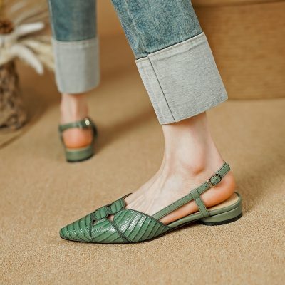 Stylish green leather open-toe sandals with adjustable ankle straps and unique cutout design, perfect for women seeking comfort and fashion.