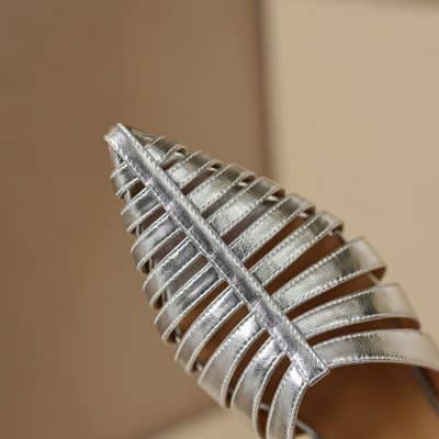 Silver metallic leaf-shaped decor, showcasing intricate design and craftsmanship, ideal for enhancing modern interior aesthetics. Perfect for decor lovers and home styling enthusiasts.