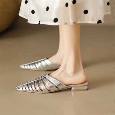 Elegant metallic pointed-toe slip-on shoes with cut-out design, perfect for fashionable women.
