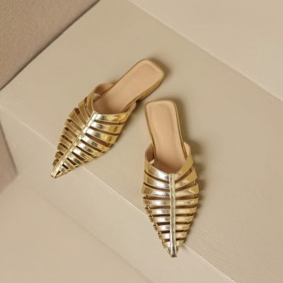 Luxurious gold women's slip-on shoes with strappy design, perfect for special occasions and stylish outfits, available at Monalisa Store.