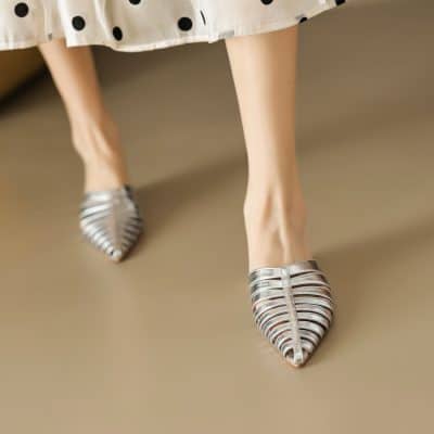 Elevate your style with fashionable silver high heels, designed for women seeking elegance and sophistication. These pointed-toe, strappy shoes are perfect for special events or adding a chic touch to any outfit.