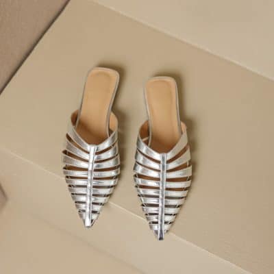 Stylish silver strappy heels perfect for trendy women, ideal for fashion-forward occasions. Comfortable design with high-quality materials, suitable for events or everyday wear.