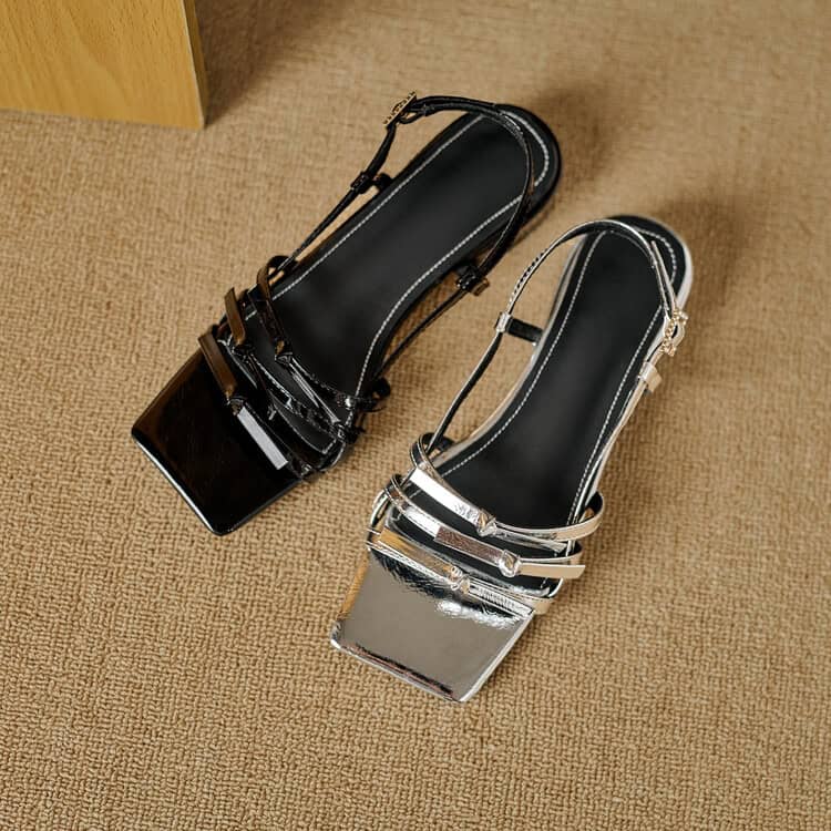 Stylish black and silver high-heeled sandals with crystal embellishments, perfect for fashion-forward women seeking trendy footwear options.