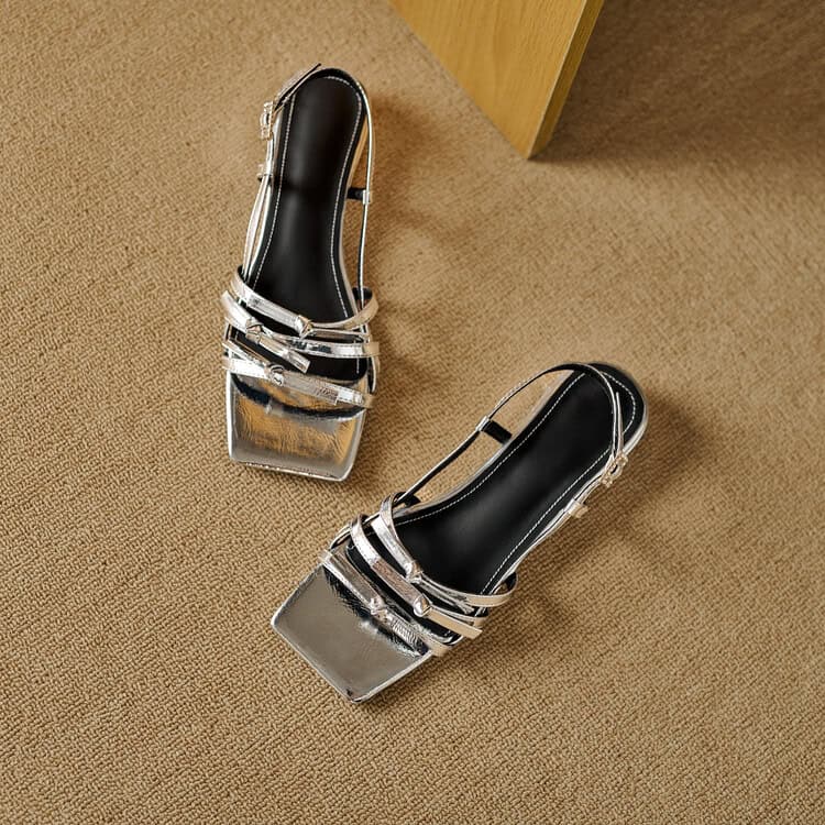Stunning metallic block heels with sleek strap details, perfect for fashion-forward looks and special occasions. Comfortable and stylish for everyday wear or night outs.
