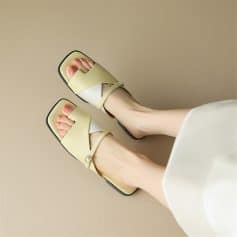 Fashionable yellow open-toe sandals with ankle straps, perfect for summer and casual occasions.