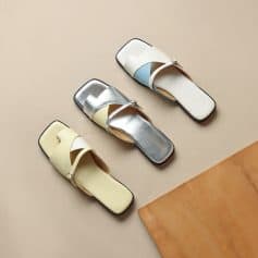 Elegant women's slides with colorful straps and comfortable flat soles, perfect for casual and trendy summer footwear.