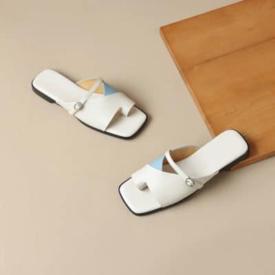 Stylish white women's sandals with a modern design, featuring comfortable straps and adjustable fittings. Perfect for summer outings, casual wear, and adding a touch of elegance to your outfit.