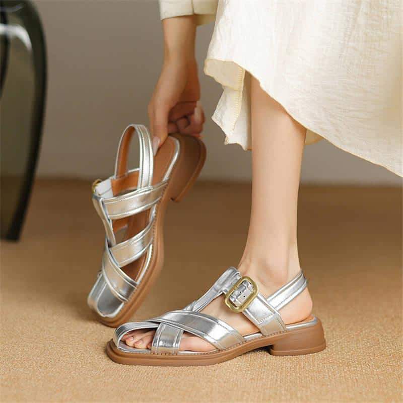 Comfortable metallic women's sandals with adjustable buckle straps, perfect for summer and casual wear. Featuring a trendy design, ideal for fashionable, everyday footwear.