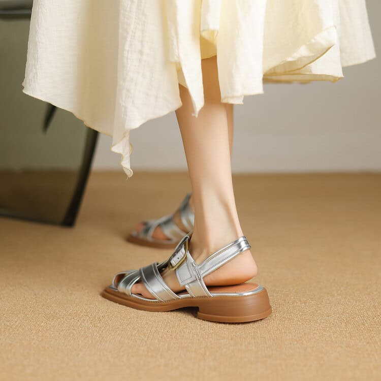Elegant silver sandals with buckle strap, perfect for summer fashion. Comfortable and trendy footwear from Monalisa Store's collection.