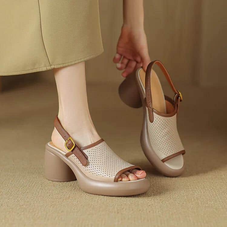 Comfortable beige platform sandals with perforated design, ankle strap, and chunky heel, perfect for stylish summer wear. Ideal for women's fashion and comfortable walking.