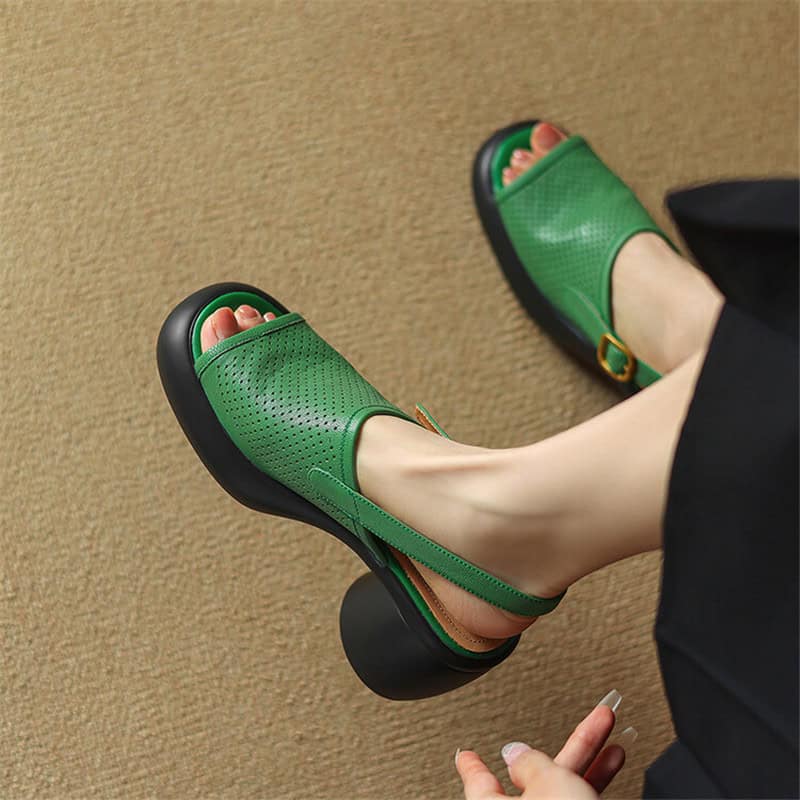 Stylish green platform sandals with perforated design, adjustable ankle strap, and chunky black heels. Perfect for trendy, comfortable summer footwear.