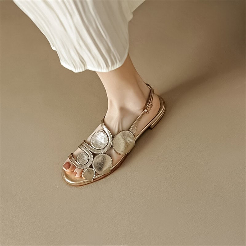 Luxurious women's fashion sandals with metallic finish and decorative circles, ideal for summer and casual wear, available at Monalisa Store.