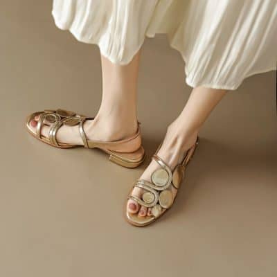 Stylish gold sandals featuring circular embellishments, perfect for summer and casual wear. Comfortable and trendy footwear available at Monalisa Store.