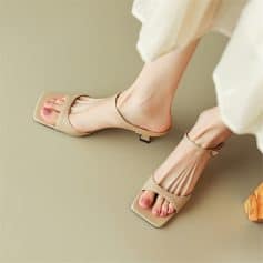 Beautiful women's beige open-toe sandals with a delicate ankle strap, perfect for modern fashion and comfortable wear.