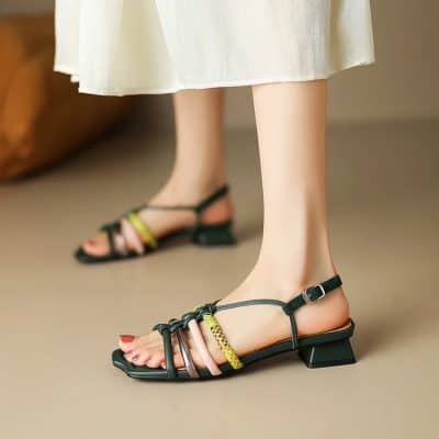 Elegant black strappy sandals with multi-colored accent straps and chunky heels for fashionable women. Perfect for daily wear or special occasions.