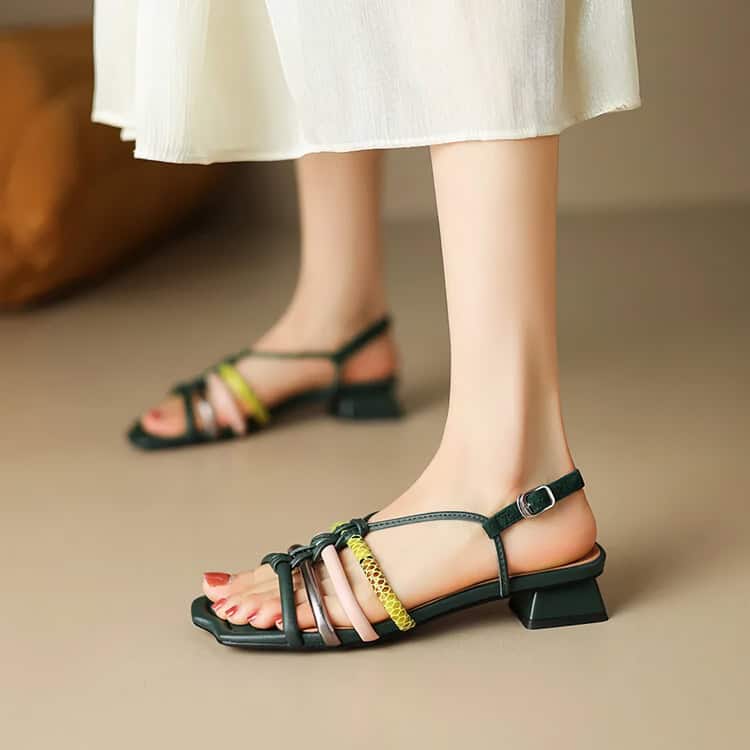 Elegant black strappy sandals with multi-colored accent straps and chunky heels for fashionable women. Perfect for daily wear or special occasions.