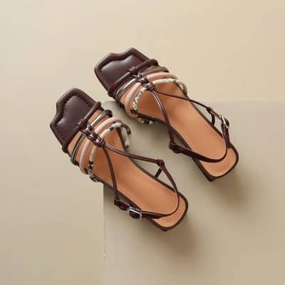 Stylish women's open-toe sandals featuring ankle straps and decorative accents, ideal for warm weather. Crafted with premium materials for comfort & fashion, perfect for complements in everyday or special outfits.