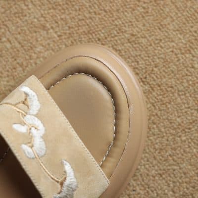 Comfortable beige slip-on slides with elegant embroidered strap, perfect for stylish and modern eyewear accessories at Monalisa Store.