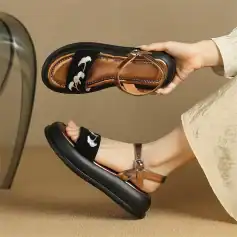 Comfortable women's open-toe sandals with stylish buckle straps and cushioned soles, perfect for everyday wear and fashionable outfits.