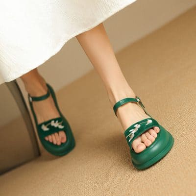Comfortable green women's sandals with ankle strap, perfect for casual and trendy outfits, available at Monalisa Medical Store, your destination for fashionable eyewear and accessories.