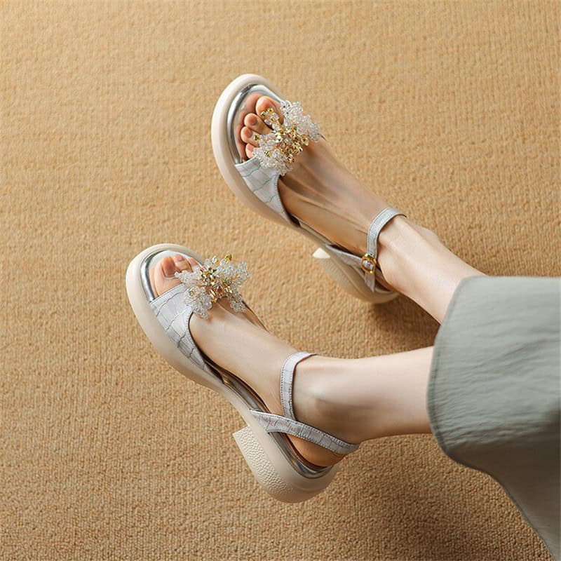 Stylish women's sandals with floral embellishments, perfect for summer and casual outings, available at Monalisa Store for fashionable footwear shopping.