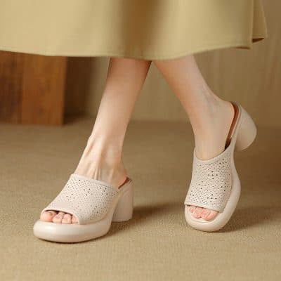 Stylish and breathable women's slip-on shoes with perforated design, perfect for spring and summer wear. Easy to put on and comfortable for everyday use, ideal for casual or office outfits.